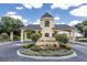 Lake Ashton community entrance with guard house and landscaping at 6265 Pinehurst Loop, Winter Haven, FL 33884