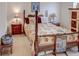 Charming bedroom featuring a wood post bed and tasteful decor at 6265 Pinehurst Loop, Winter Haven, FL 33884