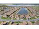 Aerial view of a luxury community with a lake at 6265 Pinehurst Loop, Winter Haven, FL 33884