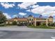 Spacious clubhouse with golf carts and flag, offering resort-style amenities at 6265 Pinehurst Loop, Winter Haven, FL 33884