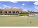 Scenic view of a golf course and pond, showcasing the community's natural beauty at 6265 Pinehurst Loop, Winter Haven, FL 33884