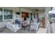 Relaxing covered patio with seating area and fire pit at 6265 Pinehurst Loop, Winter Haven, FL 33884