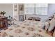 Spacious bedroom with floral bedding and ample natural light at 6265 Pinehurst Loop, Winter Haven, FL 33884