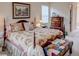 Main bedroom with floral bedding and dresser at 6265 Pinehurst Loop, Winter Haven, FL 33884