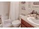 Clean bathroom with a shower/tub combo and updated vanity at 6265 Pinehurst Loop, Winter Haven, FL 33884