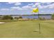 Picturesque golf course with a yellow flag marking the hole at 6265 Pinehurst Loop, Winter Haven, FL 33884