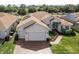 Aerial view of house with solar panels at 6265 Pinehurst Loop, Winter Haven, FL 33884