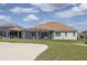 House exterior with screened patio at 6265 Pinehurst Loop, Winter Haven, FL 33884