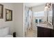 Clean bathroom with a walk-in shower and granite countertop at 274 Paradise Island Dr, Haines City, FL 33844