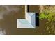 L-shaped boathouse with metal roof offering water access at 274 Paradise Island Dr, Haines City, FL 33844