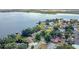 Aerial view of lakefront homes and properties with lush landscaping at 274 Paradise Island Dr, Haines City, FL 33844