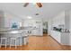 Spacious kitchen featuring white cabinets, granite countertops, and island at 274 Paradise Island Dr, Haines City, FL 33844
