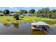 Lakefront property with a large backyard and private dock at 274 Paradise Island Dr, Haines City, FL 33844