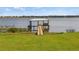 Wooden dock with covered gazebo offering serene lake views at 274 Paradise Island Dr, Haines City, FL 33844