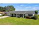 Single story home with a covered porch and well-maintained lawn at 274 Paradise Island Dr, Haines City, FL 33844