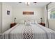 Bright and airy main bedroom with a king-size bed and neutral decor at 274 Paradise Island Dr, Haines City, FL 33844