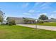 Single-story home with attached garage and a well-maintained lawn at 274 Paradise Island Dr, Haines City, FL 33844