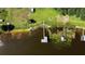 High-angle view of a lakefront dock and boathouse at 274 Paradise Island Dr, Haines City, FL 33844