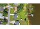 Drone shot of a house with a large backyard and private dock at 274 Paradise Island Dr, Haines City, FL 33844