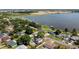 Aerial view of lakefront community with homes and pools at 274 Paradise Island Dr, Haines City, FL 33844