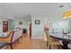 Spacious dining room with a round table and view into the living room at 274 Paradise Island Dr, Haines City, FL 33844