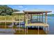Two covered docks with seating and lake access at 274 Paradise Island Dr, Haines City, FL 33844