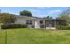 Large backyard with screened patio and grill area at 274 Paradise Island Dr, Haines City, FL 33844