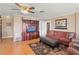 Cozy living room featuring hardwood floors and a built-in entertainment center at 274 Paradise Island Dr, Haines City, FL 33844