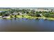 Wide aerial showcasing lakefront community and waterfront homes at 274 Paradise Island Dr, Haines City, FL 33844