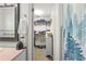 Clean bathroom with a walk-in closet and tiled floors at 274 Paradise Island Dr, Haines City, FL 33844