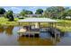 Lakefront property with large covered dock and spacious deck at 274 Paradise Island Dr, Haines City, FL 33844