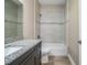 Clean bathroom with tile shower/tub combo and granite countertop at 3671 E Gaskins Rd, Bartow, FL 33830