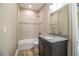 Clean bathroom with granite countertop, dark vanity, and tile shower/tub combo at 3671 E Gaskins Rd, Bartow, FL 33830