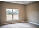 Bright bedroom with large window and neutral carpeting at 3671 E Gaskins Rd, Bartow, FL 33830