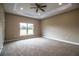 Spacious bedroom with ceiling fan and neutral carpeting at 3671 E Gaskins Rd, Bartow, FL 33830