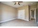 Spacious bedroom with ceiling fan and neutral carpeting at 3671 E Gaskins Rd, Bartow, FL 33830