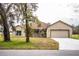 Charming one-story house with a tree-lined street and spacious front yard at 3671 E Gaskins Rd, Bartow, FL 33830
