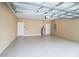 Spacious garage with light gray epoxy flooring and a water heater at 3671 E Gaskins Rd, Bartow, FL 33830