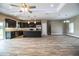 Open plan kitchen boasts an island, stainless steel appliances, and dark cabinetry at 3671 E Gaskins Rd, Bartow, FL 33830