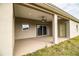 Covered patio with ceiling fan and sliding glass doors at 3671 E Gaskins Rd, Bartow, FL 33830