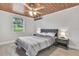 Bedroom with wood ceiling, ceiling fan, and window at 724 Hillside Ave, Lake Wales, FL 33853