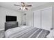 Bedroom with sliding door closet and TV at 724 Hillside Ave, Lake Wales, FL 33853