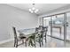 Bright dining area with table and chairs, and access to a sunroom at 724 Hillside Ave, Lake Wales, FL 33853