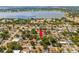 Aerial view showing a house's location in a residential neighborhood near a lake at 724 Hillside Ave, Lake Wales, FL 33853