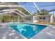 Inviting screened pool with patio chairs at 724 Hillside Ave, Lake Wales, FL 33853