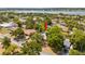 Aerial view of a single-Gathering home with a large backyard, located near a lake at 724 Hillside Ave, Lake Wales, FL 33853