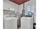 Laundry room with washer, dryer, and shelving at 724 Hillside Ave, Lake Wales, FL 33853