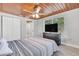 Bedroom with wood ceiling, TV, and dresser at 724 Hillside Ave, Lake Wales, FL 33853