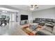 Spacious living room featuring a sectional sofa and large TV at 724 Hillside Ave, Lake Wales, FL 33853