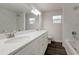 Updated bathroom with double vanity, marble tile, and modern fixtures at 318 Senate St, Auburndale, FL 33823